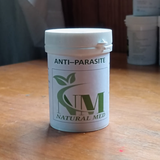 Anti-parasite supplement container on a wooden surface with 'Natural Med' branding.