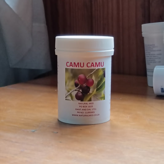 Camu camu supplement container on a wooden surface