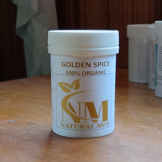 Container of Golden Spice by Natural Med on a wooden surface