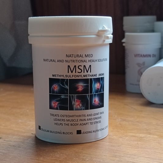 Container of MSM supplement on a wooden surface with blurred background
